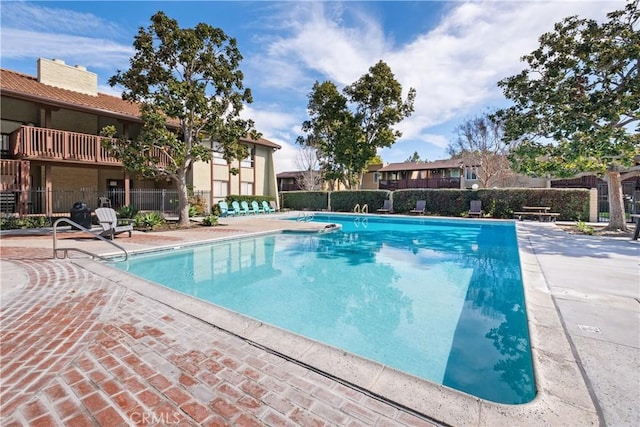 view of swimming pool featuring a patio area