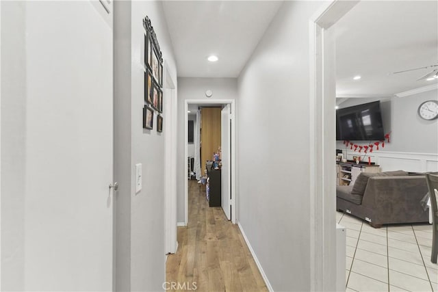 corridor featuring light tile patterned floors