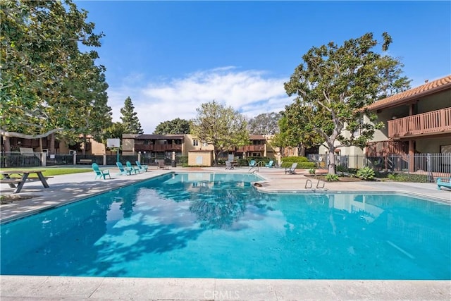 view of swimming pool with a patio area