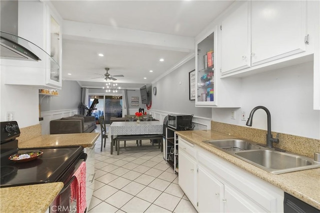 kitchen with black appliances, ceiling fan, light tile patterned floors, sink, and white cabinetry