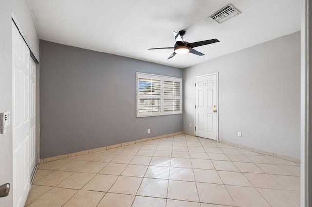 unfurnished bedroom featuring ceiling fan and light tile patterned floors