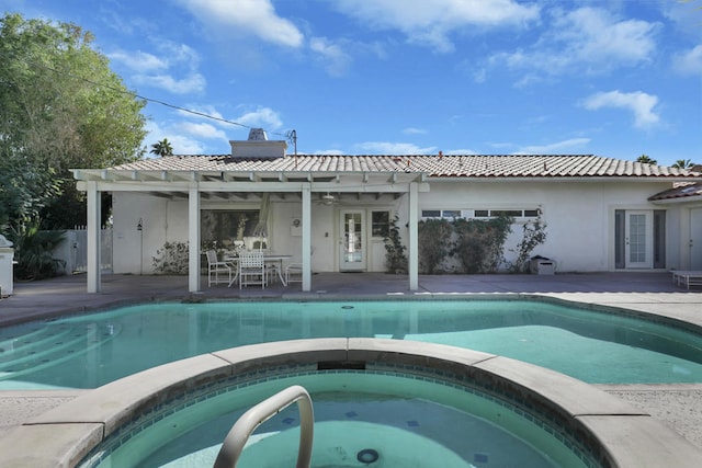 view of pool with an in ground hot tub, a patio, and a pergola