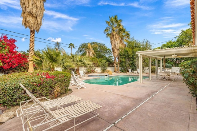 view of pool with an in ground hot tub, a patio, ceiling fan, and a pergola