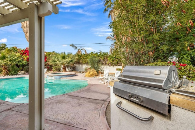 view of pool featuring an in ground hot tub, grilling area, and a patio