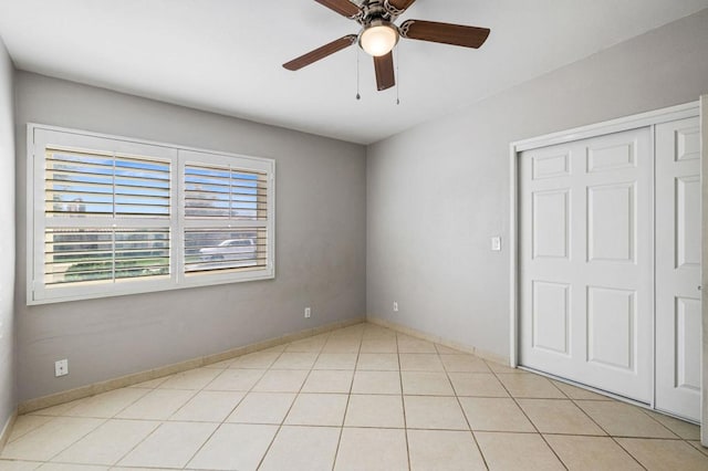 unfurnished bedroom featuring a closet and ceiling fan