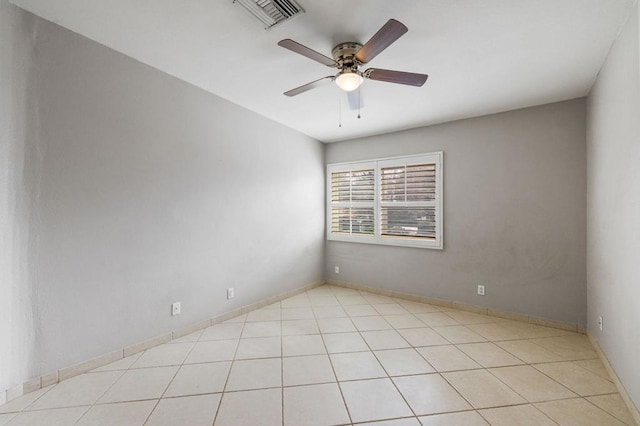 unfurnished room featuring ceiling fan and light tile patterned flooring