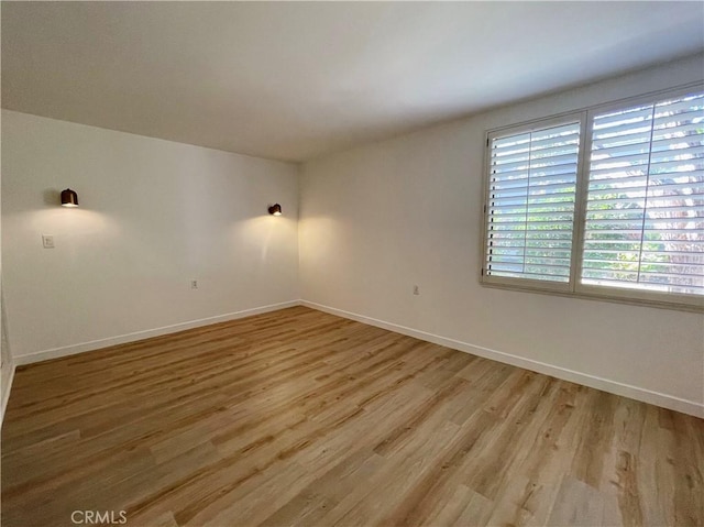 unfurnished room featuring light hardwood / wood-style floors