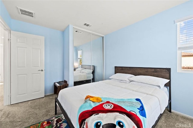 bedroom featuring carpet flooring and a closet