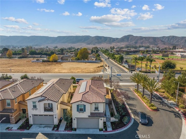 birds eye view of property featuring a mountain view