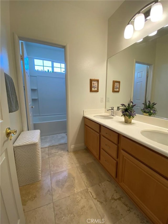 bathroom featuring shower / bath combination and vanity