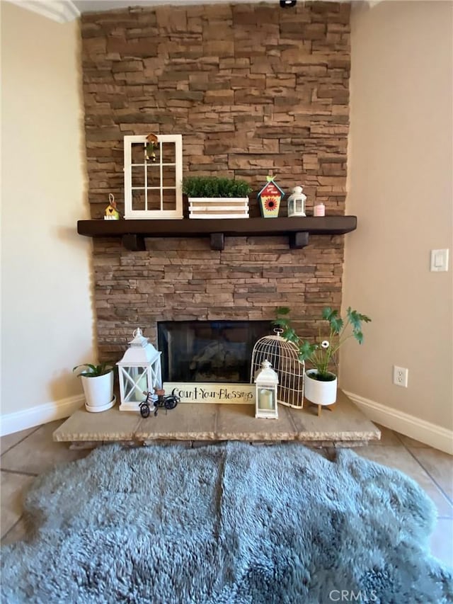 interior details featuring a stone fireplace