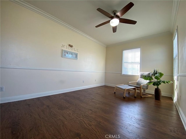 empty room featuring ceiling fan, ornamental molding, and dark hardwood / wood-style floors