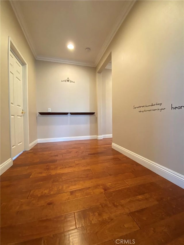 hall featuring hardwood / wood-style flooring and ornamental molding