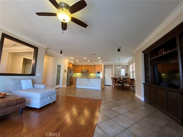 tiled living room with ornamental molding