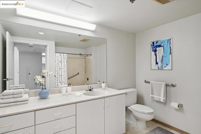 bathroom featuring tile patterned floors, toilet, vanity, and a shower with shower curtain