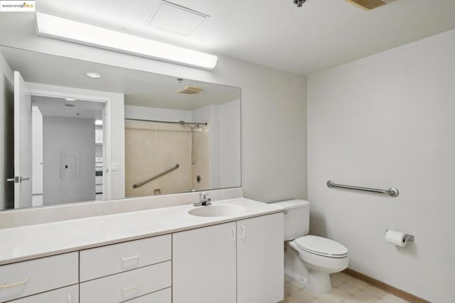 bathroom with toilet, vanity, and walk in shower