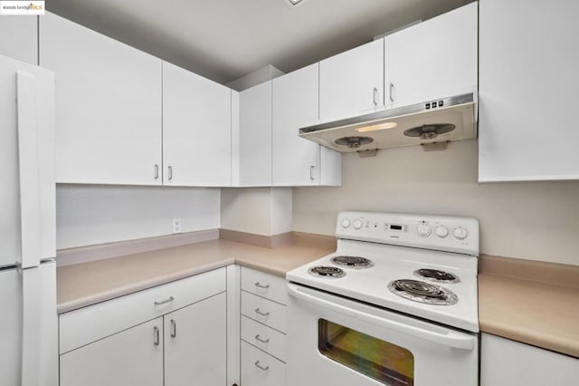 kitchen with white appliances and white cabinetry