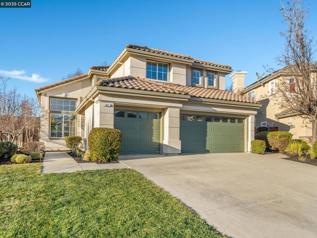 mediterranean / spanish-style home featuring a garage and a front lawn