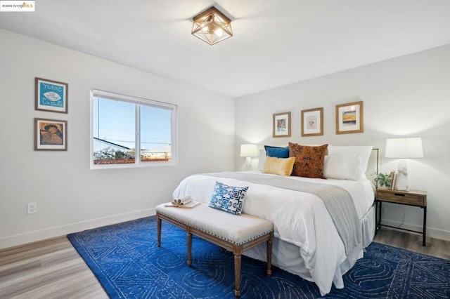 bedroom featuring wood-type flooring