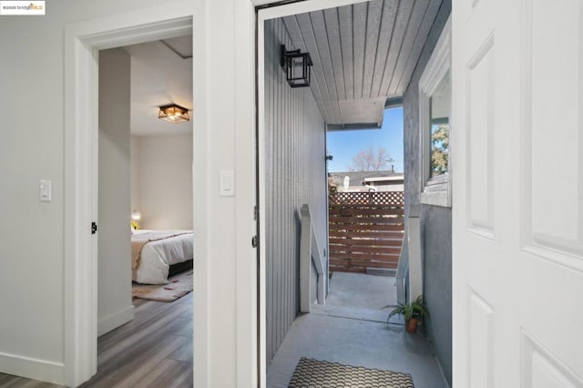 corridor featuring hardwood / wood-style flooring