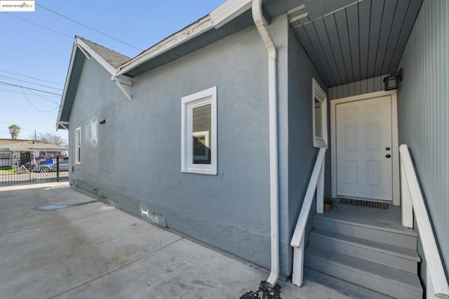 view of side of home featuring a patio