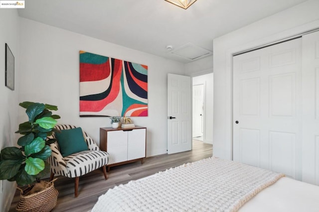 bedroom with hardwood / wood-style flooring and a closet