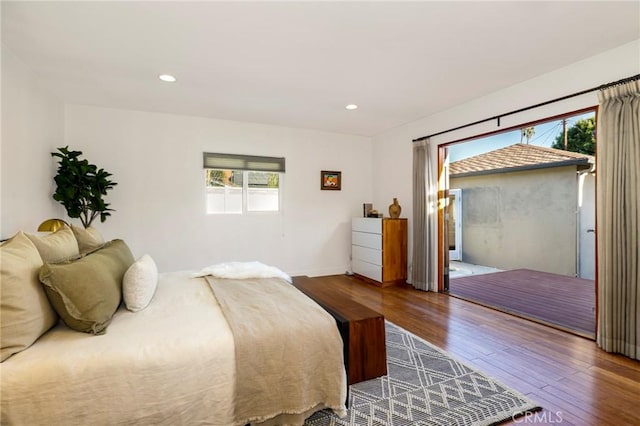 bedroom with hardwood / wood-style floors