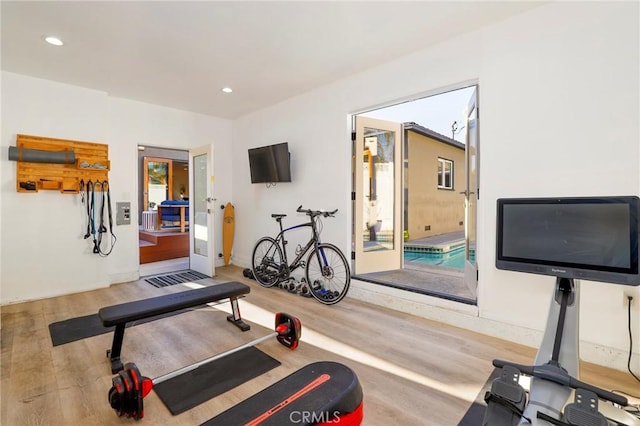 workout room featuring hardwood / wood-style flooring