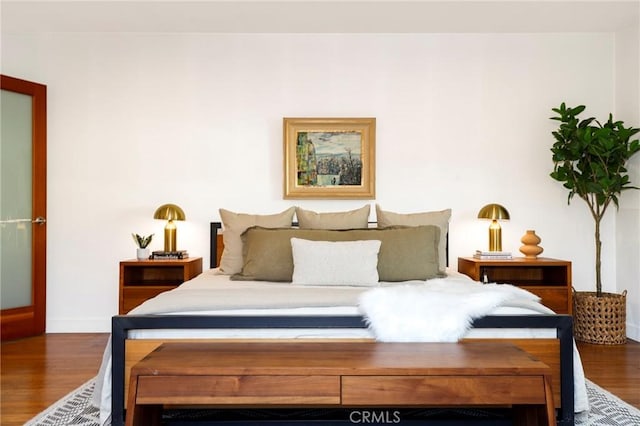 bedroom featuring dark wood-type flooring