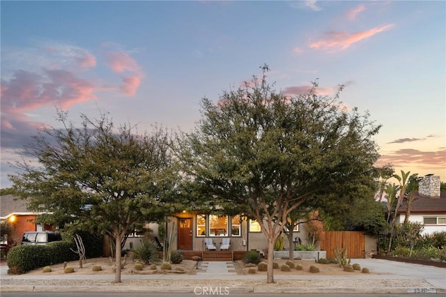 view of property hidden behind natural elements