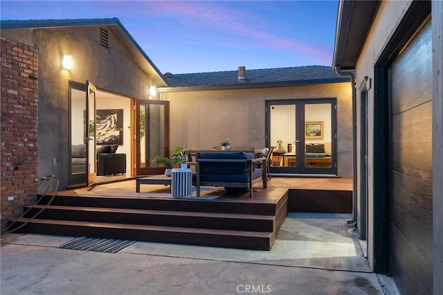 patio terrace at dusk with a deck