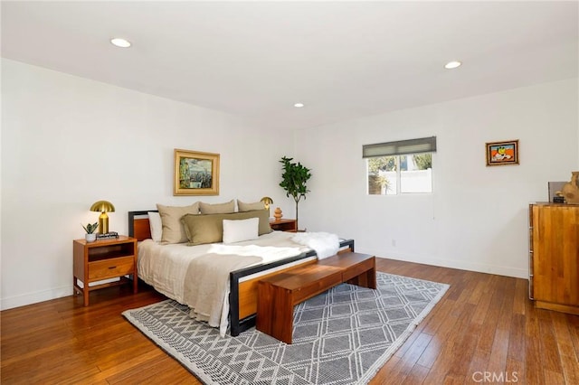 bedroom with hardwood / wood-style flooring