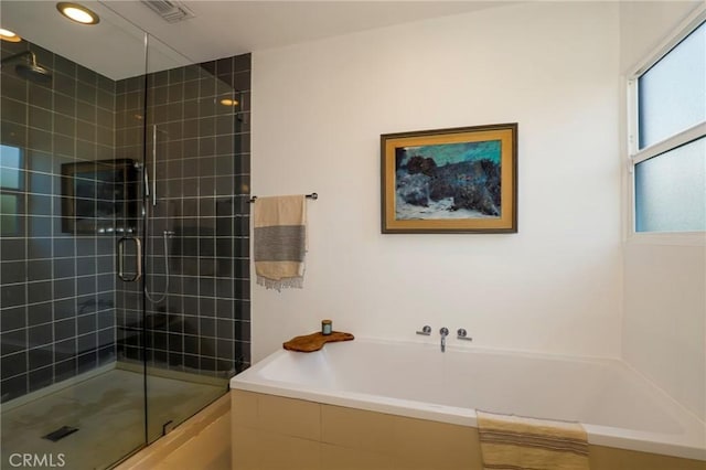 bathroom featuring plus walk in shower