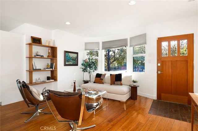 living area with hardwood / wood-style flooring