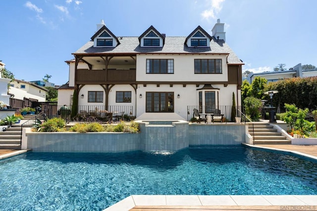 back of property with french doors and a patio area