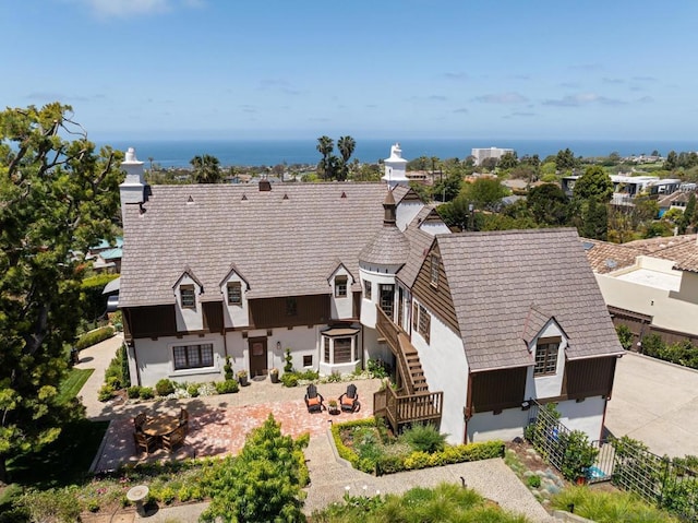 back of house featuring a water view