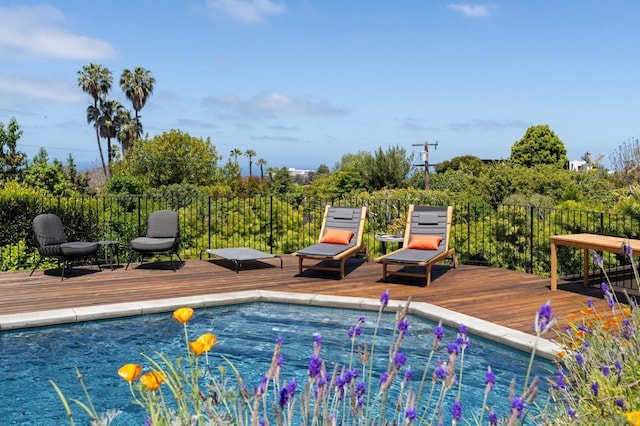 view of swimming pool featuring a wooden deck