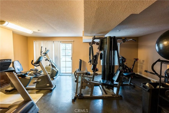 workout area with a textured ceiling