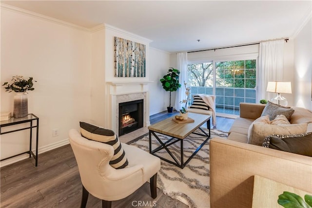 living room with dark hardwood / wood-style flooring and ornamental molding