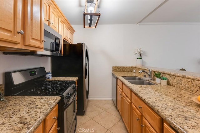 kitchen with crown molding, light stone countertops, appliances with stainless steel finishes, light tile patterned floors, and sink