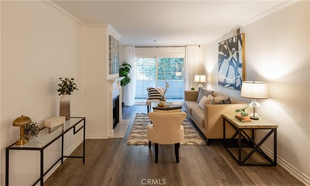 living room featuring ornamental molding and wood-type flooring