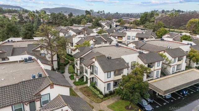 birds eye view of property with a mountain view