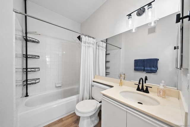 full bathroom featuring vanity, wood-type flooring, toilet, and shower / bath combo with shower curtain