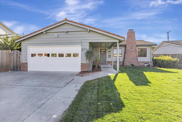 view of front facade featuring a garage and a front yard