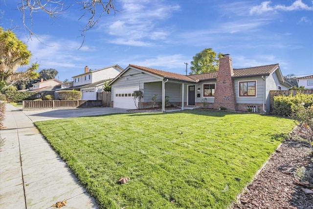 view of front facade with a garage and a front yard