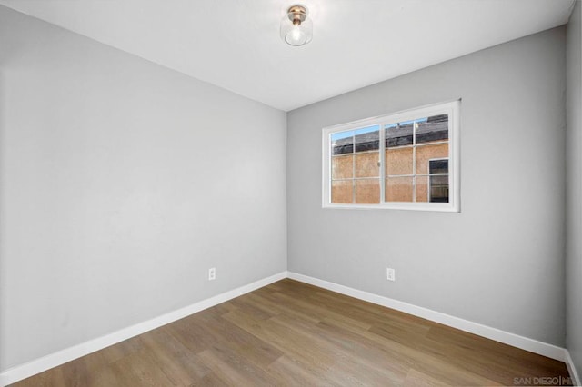 spare room featuring hardwood / wood-style flooring