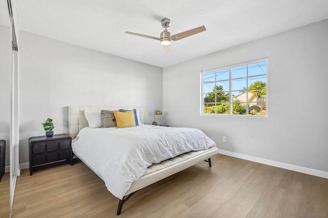 bedroom featuring hardwood / wood-style flooring and ceiling fan