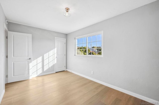 unfurnished room featuring light hardwood / wood-style floors