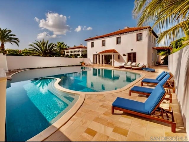 view of swimming pool with a patio