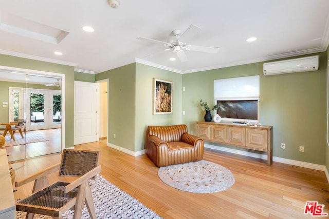 sitting room featuring a wall mounted air conditioner, french doors, ornamental molding, and light hardwood / wood-style floors